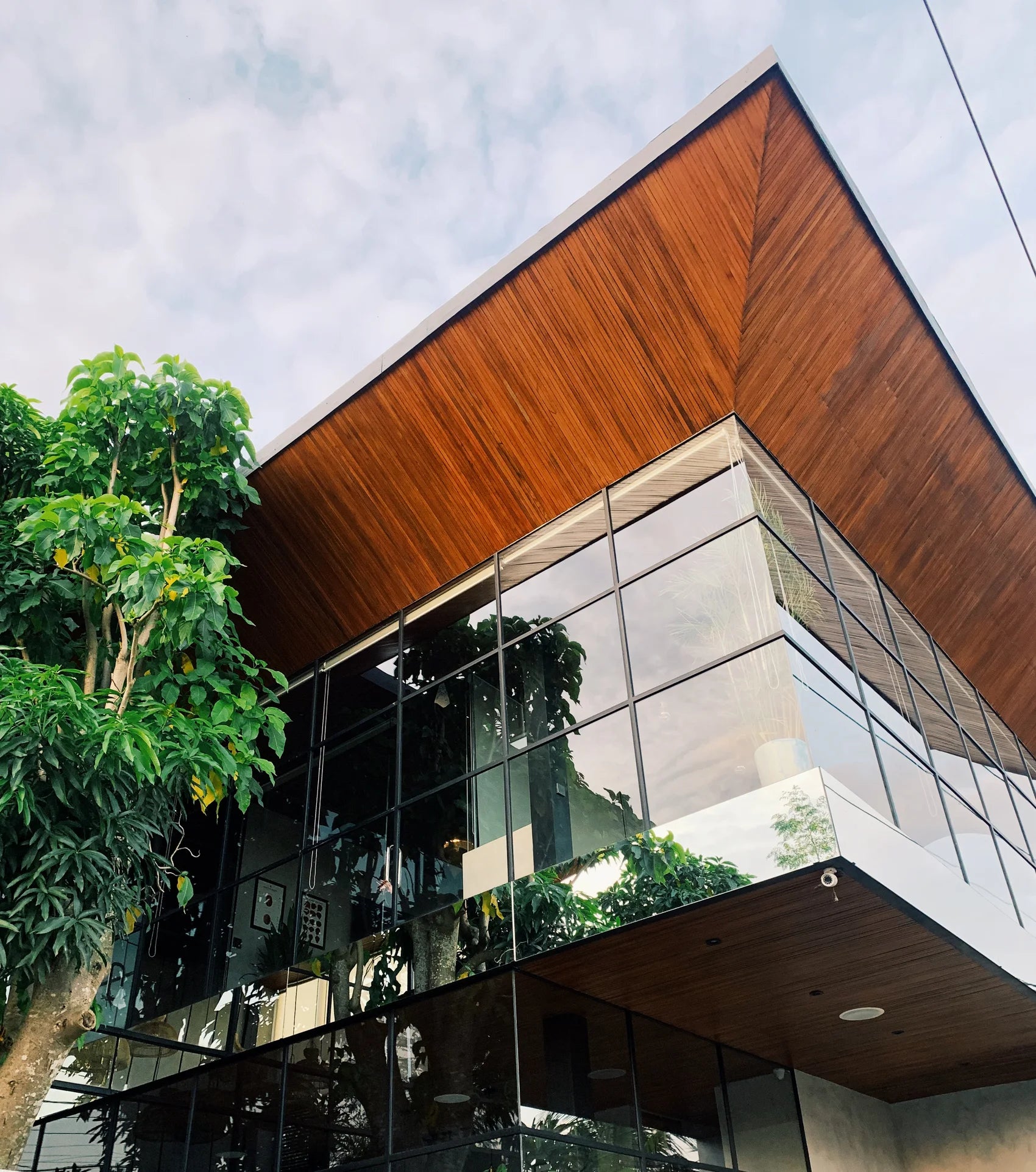 The timber roof and glass façade in Umalas